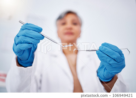 Dentist, hands and tools, healthcare and person at clinic for teeth cleaning, wellness and excavator for cavity. Dentist, metal equipment and health closeup, orthodontics and dental care with gloves Dentist, hands and tools, healthcare and person at clinic for teeth cleaning, wellness and excavator for cavity. Dentist, metal equipment and health closeup, orthodontics and dental care with gloves 106949421