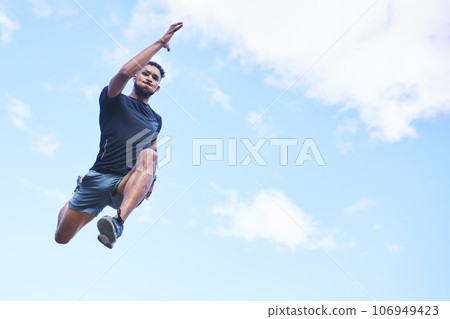Runner man, jump and sky with space for mockup, clouds and fitness in nature, action and freedom. Athlete guy, low angle and outdoor for workout, exercise and training with fast moving for health 106949423