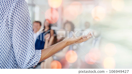 Person, speaker and presentation in meeting, seminar or conference for training staff against a bokeh background. Professional business leader talking to people, audience or workshop on mockup space 106949427