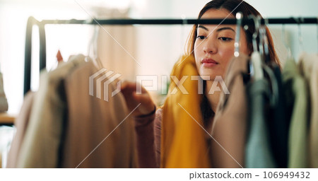 Retail clothes, happy shopping and woman in luxury designer store for fashion choice on railing in boutique. Rich Asian customer with wealth looking for clothing on discount during sale in mall Retail clothes, happy shopping and woman in luxury designer store for fashion choice on railing in boutique. Rich Asian customer with wealth looking for clothing on discount during sale in mall 106949432