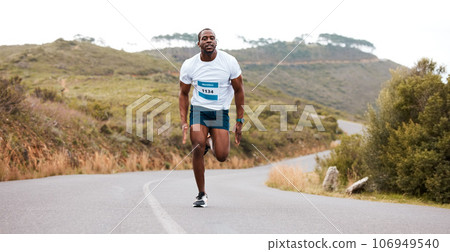 Fitness, running and and man in a road for marathon, sports and training, morning or cardio routine. Runner, workout and African male athlete in street with energy, exercise or resilience performance 106949540