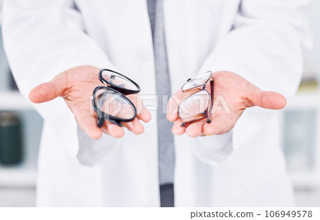 Hands, glasses choice and optometry, vision and person at eye care clinic, doctor with help or advice. Frame, prescription lens and decision for optometrist healthcare, medical and cosmetic closeup Hands, glasses choice and optometry, vision and person at eye care clinic, doctor with help or advice. Frame, prescription lens and decision for optometrist healthcare, medical and cosmetic closeup 106949578