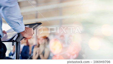 Person, speaker and podium in meeting, seminar or conference for training staff against a bokeh background. Professional business leader talking to people or audience in presentation on mockup space Person, speaker and podium in meeting, seminar or conference for training staff against a bokeh background. Professional business leader talking to people or audience in presentation on mockup space 106949706