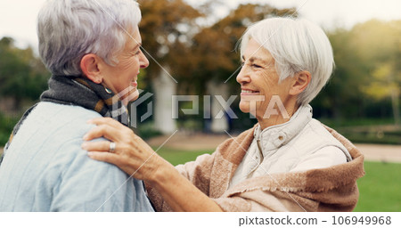 Love, care and senior women embracing for affection, romance and bonding on an outdoor date. Nature, commitment and elderly female couple in retirement hugging in a green garden or park together. Love, care and senior women embracing for affection, romance and bonding on an outdoor date. Nature, commitment and elderly female couple in retirement hugging in a green garden or park together. 106949968