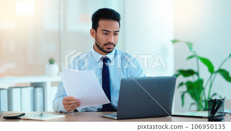 Young man working on his laptop in an office frustrated, stressed and angry about a bad sales report after a marketing campaign. Business manager upset and annoyed that he didnt hit his deadline Young man working on his laptop in an office frustrated, stressed and angry about a bad sales report after a marketing campaign. Business manager upset and annoyed that he didnt hit his deadline 106950135