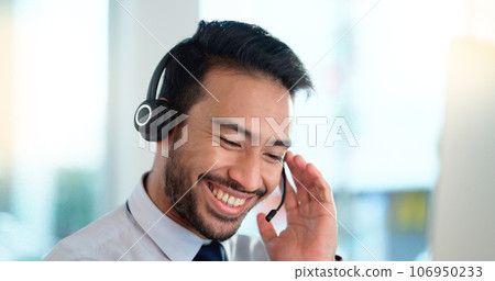 Call center agent consulting a buyer via video call in an office. A young friendly sales man talking to a client in a virtual meeting. A male customer service employee advising a consumer 106950233