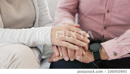 Closeup of senior couple holding hands for love, care and trust in retirement. Old man, woman and helping hand for loyalty to partner in kindness, hope and support to forgive, with empathy at home Closeup of senior couple holding hands for love, care and trust in retirement. Old man, woman and helping hand for loyalty to partner in kindness, hope and support to forgive, with empathy at home 106950993