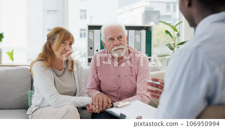 Counseling, support and senior couple with therapist in consultation for help, talk or crisis guidance. Therapy, depression and old people holding hands consulting marriage or mental health expert Counseling, support and senior couple with therapist in consultation for help, talk or crisis guidance. Therapy, depression and old people holding hands consulting marriage or mental health expert 106950994