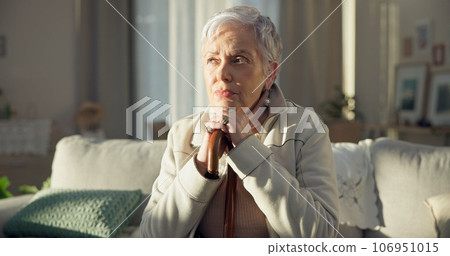 Home, thinking and old woman with depression, memory and remember with thoughts, wonder and sad. Female person, mature lady and pensioner on a couch, nursing facility and retirement with Alzheimer 106951015