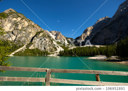 Turquoise Lake Braies surrounded by rocky mountains in Prags Dolomites Turquoise Lake Braies surrounded by rocky mountains in Prags Dolomites 106952891
