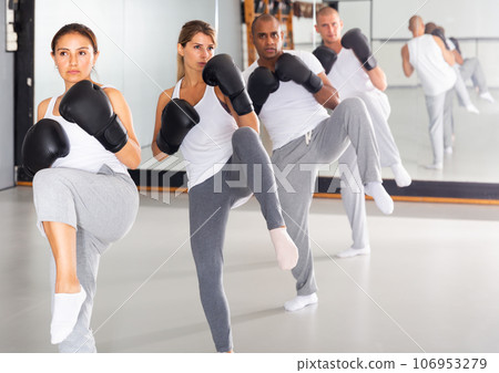 Adult people practicing kick in training room 106953279