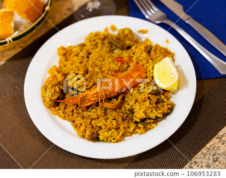 Paella with seafood served in a plate Paella with seafood served in a plate 106953283