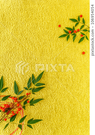 Japanese style background of Nanten leaves and red berries on gold Japanese paper 106954054