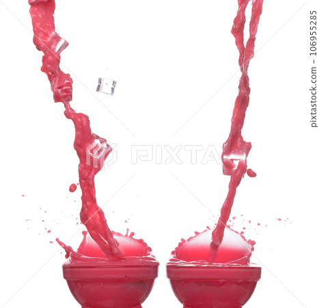 Red tomato strawberry juice spill splash in glass bowl, Red blood wave fall in air. Red Wine colored explosion spill out up. White background Isolated series two of images 106955285