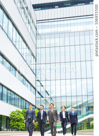 Group of executive business people walking side by side in the city 106955500