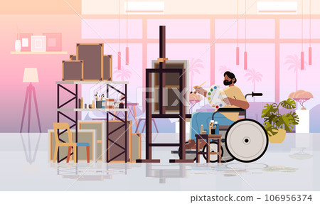 disabled man artist in wheelchair drawing on canvas creative art hobby people with disabilities concept modern studio interior 106956374
