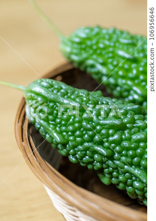 Bitter gourd harvested from a home garden 106956646