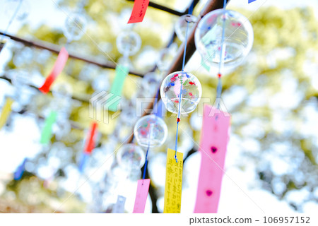 Wind chimes swaying in the wind 106957152
