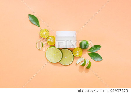 Unlabeled white jar arranged with kumquat and lime cut in slices. Peels and green leaves also displayed. Lime and Kumquat can help protect you from infection Unlabeled white jar arranged with kumquat and lime cut in slices. Peels and green leaves also displayed. Lime and Kumquat can help protect you from infection 106957373