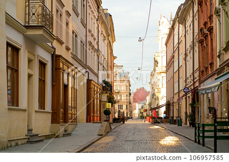 the central square is empty,20.07.2023 UKRAINE, LVIV, lantern in the middle of an empty square in the city of Lviv, quarantining in the streets of Lviv the central square is empty,20.07.2023 UKRAINE, LVIV, lantern in the middle of an empty square in the city of Lviv, quarantining in the streets of Lviv 106957585