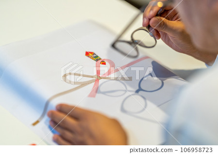 Put on your reading glasses and prepare to write on the paper 106958723