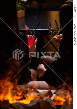 Clinking glasses with alcohol and toasting, party. Clinking glasses with alcohol and toasting, party. 106958993