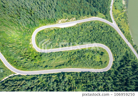 View from above of the mountain winding road in summer. Carpathian mountains. Ukraine View from above of the mountain winding road in summer. Carpathian mountains. Ukraine 106959250