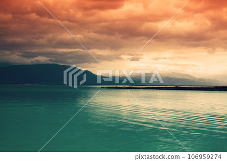 Seascape in dramatic light. The Dead Sea during sunset. Unique sea in the world. Israel Seascape in dramatic light. The Dead Sea during sunset. Unique sea in the world. Israel 106959274