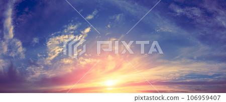 Panorama of a colorful cloudy sky at sunset. Sky texture. Abstract nature background 106959407