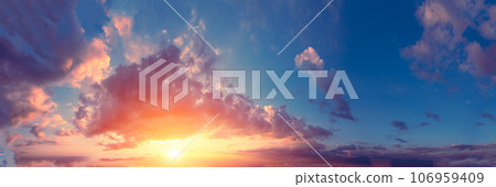 Panorama of a colorful cloudy sky at sunset. Sky texture. Abstract nature background Panorama of a colorful cloudy sky at sunset. Sky texture. Abstract nature background 106959409