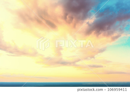 Colorful cloudy sky at sunset. Gradient color. Sky texture. Abstract nature background Colorful cloudy sky at sunset. Gradient color. Sky texture. Abstract nature background 106959411