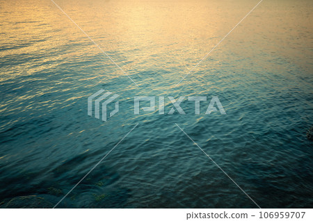 Top view of seawater at sunset. Abstract nature landscape background. Gradient color Top view of seawater at sunset. Abstract nature landscape background. Gradient color 106959707