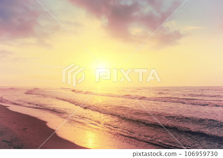 Seascape in the early morning. Sunrise over the sea with beautiful sky. Nature landscape. Sandy beach in summer Seascape in the early morning. Sunrise over the sea with beautiful sky. Nature landscape. Sandy beach in summer 106959730