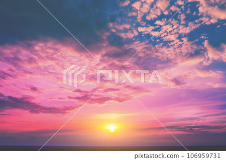 Colorful cloudy sky over the sea at sunset. Sky texture. Abstract nature background Colorful cloudy sky over the sea at sunset. Sky texture. Abstract nature background 106959731