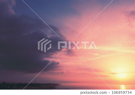 Seascape in the evening. Sunset over the sea with beautiful dramatic sky Seascape in the evening. Sunset over the sea with beautiful dramatic sky 106959734
