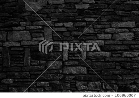 Sturdy black and white cut stone wall made in Datca, Turkey, seamless lined up 106960007