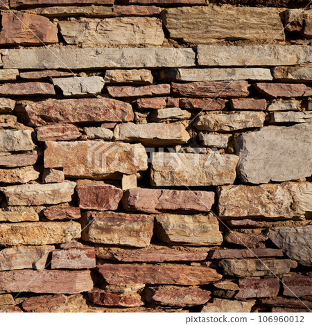 Sturdy yellow and beige cut stone wall made in Datca, Turkey, seamless lined up Sturdy yellow and beige cut stone wall made in Datca, Turkey, seamless lined up 106960012