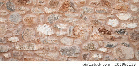 Sturdy yellow and beige cut stone wall made in Datca, Turkey, seamless lined up Sturdy yellow and beige cut stone wall made in Datca, Turkey, seamless lined up 106960132
