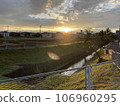 River illuminated by the setting sun, twilight 106960295