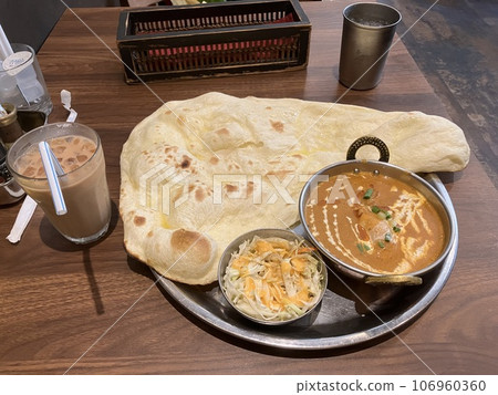 Curry, naan and iced chai Curry, naan and iced chai 106960360