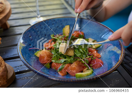 Young woman eating healthy salad at restuarant, Healthy lifestyle, diet concept. Young woman eating healthy salad at restuarant, Healthy lifestyle, diet concept. 106960435