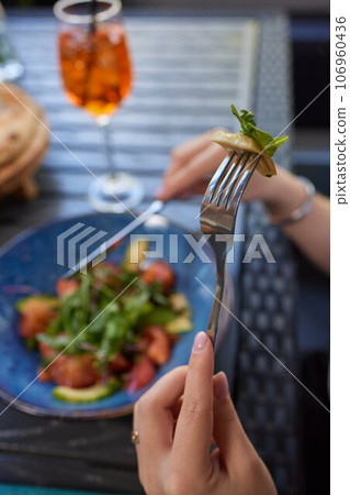 Young woman eating healthy salad at restuarant, Healthy lifestyle, diet concept. Young woman eating healthy salad at restuarant, Healthy lifestyle, diet concept. 106960436