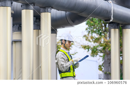 Engineer inspecting plumbing equipment Engineer inspecting plumbing equipment 106960576