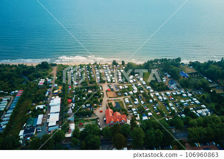 Aerial view of campsite with trailers near Baltic sea beach in Wladyslawowo, Poland. Tourists have rest during summer vacation season 106960863