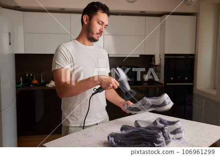 vacuum packing sneakers. for seasonal storage close-up. vacuum packing sneakers. for seasonal storage close-up. 106961299
