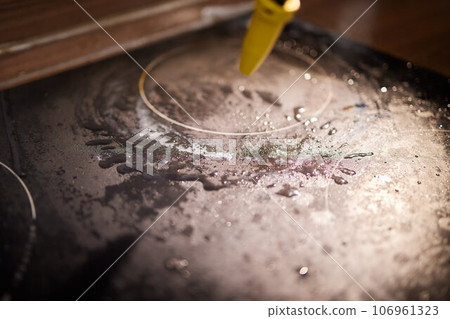 Cleaning of induction cooker with steam cleaner Cleaning of induction cooker with steam cleaner 106961323