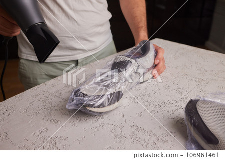 vacuum packing sneakers. for seasonal storage close-up. 106961461