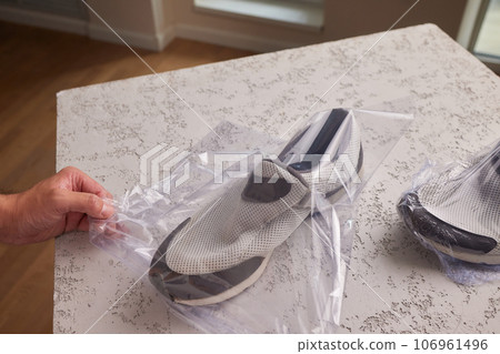 vacuum packing sneakers. for seasonal storage close-up. 106961496