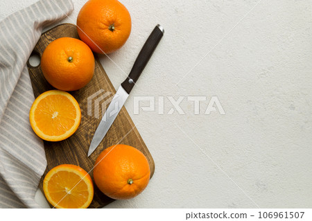 Fresh ripe oranges on cutting board on table. Top view Flat lay 106961507