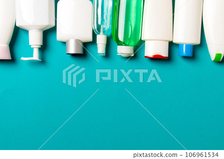 Group of plastic bodycare bottle Flat lay composition with cosmetic products on colored background empty space for you design. Set of White Cosmetic containers, top view with copy space 106961534